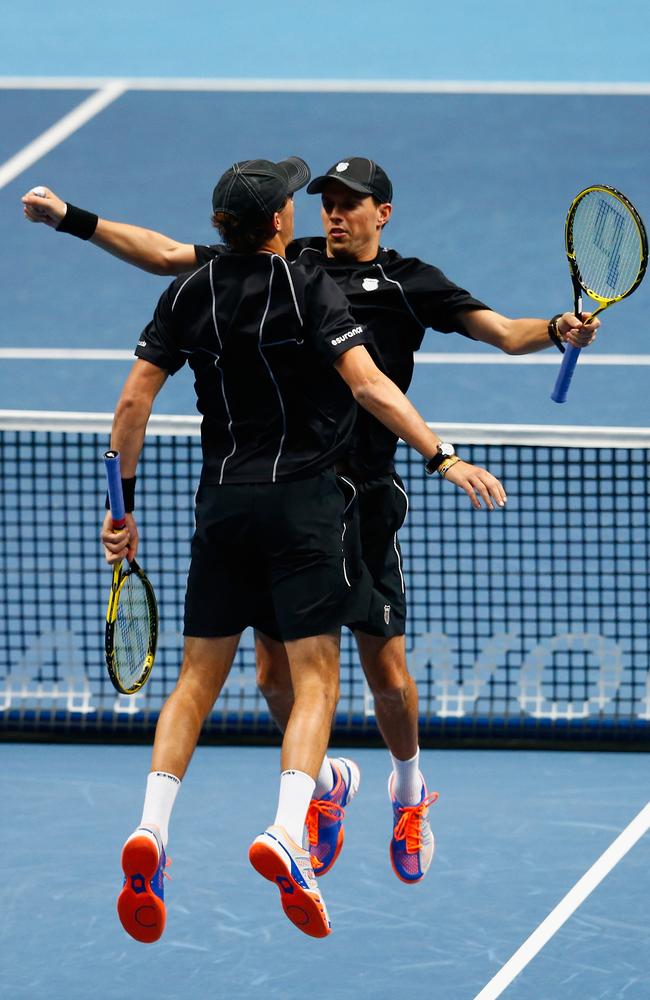 Bob and Mike Bryan do their trademark chest bump after winning the ATP Finals.