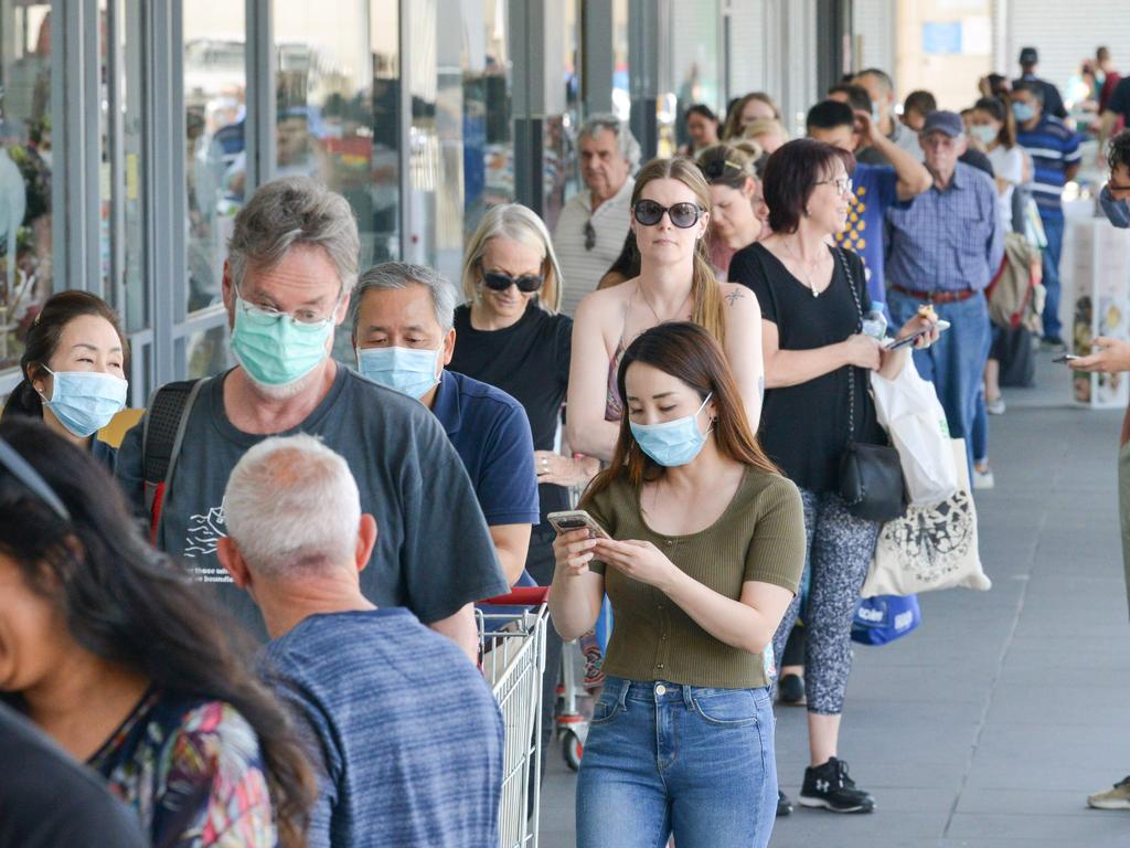 People queue at a supermarket after the South Australian state government announced a six-day lockdown. Picture: AFP