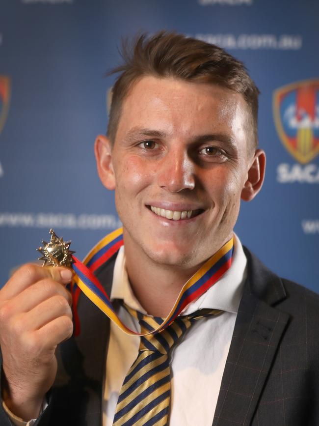 West Torrens’ Kelvin Smith, pictured after jointly winning last season’s Bradman Medal with Woodville’s Conor McInerney, is a shot at going to back-to-back. Picture: AAP/Dean Martin