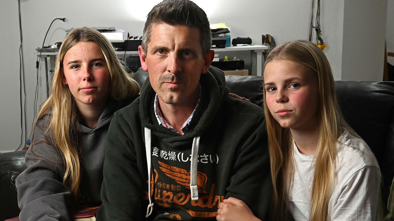 Lee Lovell and his daughters Scarlett (oldest) and Kassie at their home in North Lakes Brisbane. Pic: Lyndon Mechielsen/Courier Mail