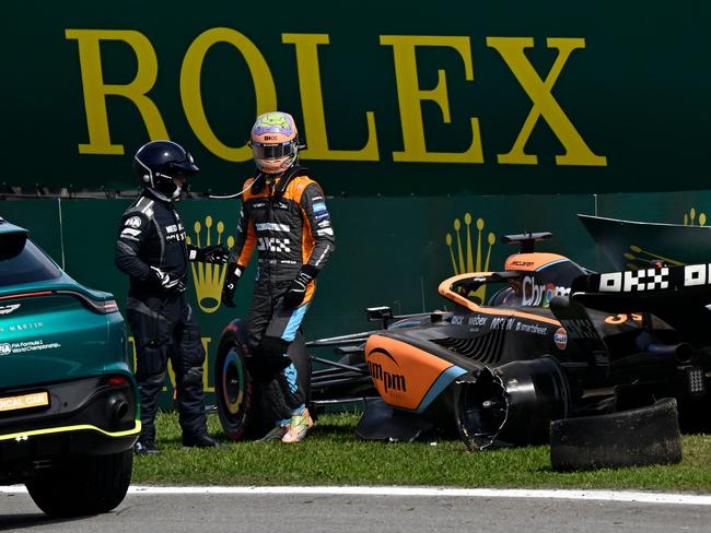 A familiar sight at McLaren: Daniel Ricciardo gets out of his car after crashing with Haas driver Kevin Magnussen. Picture: AFP