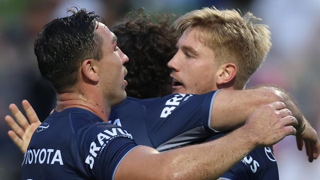 SYDNEY, AUSTRALIA - MARCH 23: Tom Dearden of the Cowboys celebrates scoring a try with Reece Robson of the Cowboys during the round three NRL match between St George Illawarra Dragons and North Queensland Cowboys at Netstrata Jubilee Stadium on March 23, 2024 in Sydney, Australia. (Photo by Jason McCawley/Getty Images)