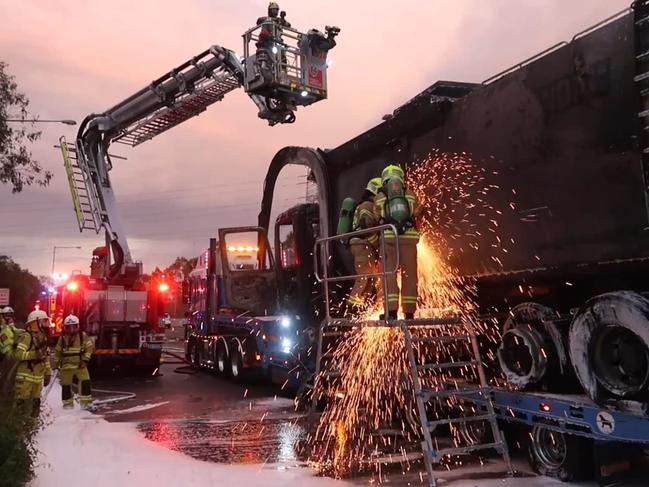 Fire crews attend a dramatic garbage truck fire on the M7 Motorway at Horsley Park in January.