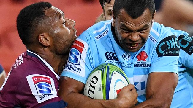 Kurtley Beale of the Waratahs (right) is tackled by Samu Kerevi of the Reds on his way to score a try during the Round 14 Super Rugby match between the Queensland Reds and the NSW Waratahs at Suncorp Stadium in Brisbane, Saturday, May 18, 2019. (AAP Image/Dan Peled) NO ARCHIVING, EDITORIAL USE ONLY