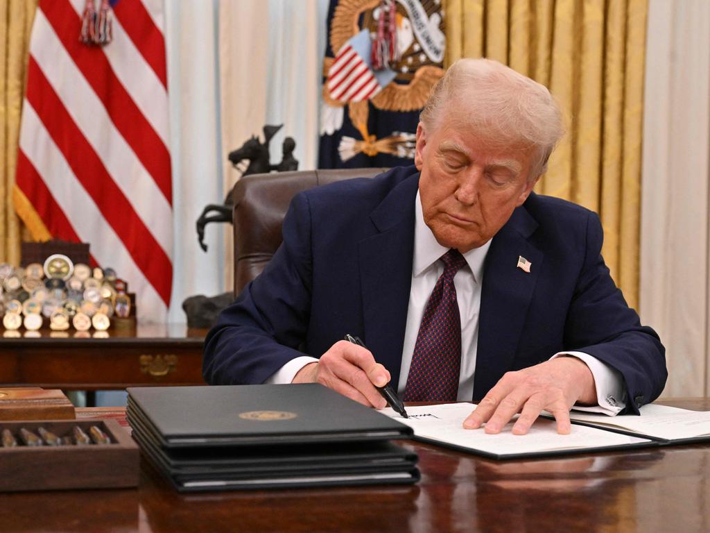 US President Donald Trump signs an executive order to declassify files of former President John F. Kennedy, former Attorney General Robert F. Kennedy and civil rights leader Martin Luther King Jr. Picture: AFP