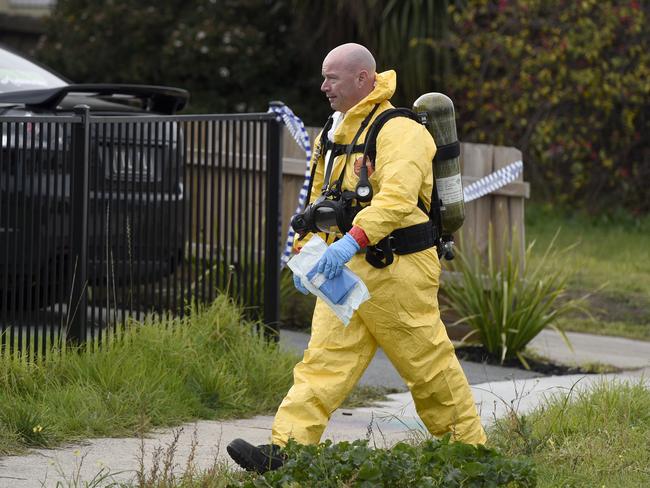 Forensic investigators donned full hazmat suits as they entered the home. Picture: Andrew Henshaw