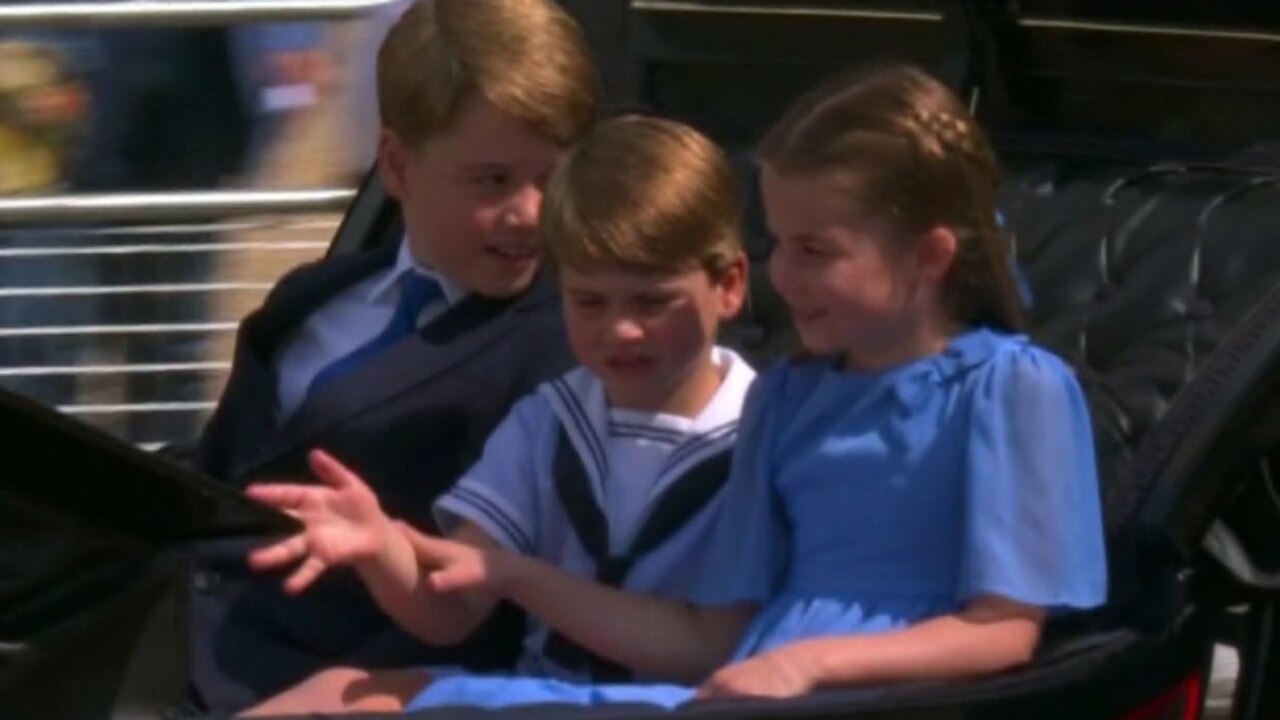 This is the adorable moment Princess Charlotte playfully calms her little brother as he enthusiastically waves to enormous crowds watching Trooping the Colour. Picture: Supplied