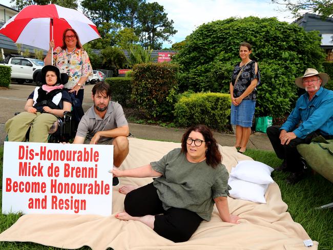 Protesters call for Public Works Minister Mick de Brenni’s resignation outside his electorate office earlier this month. Picture: David Clark