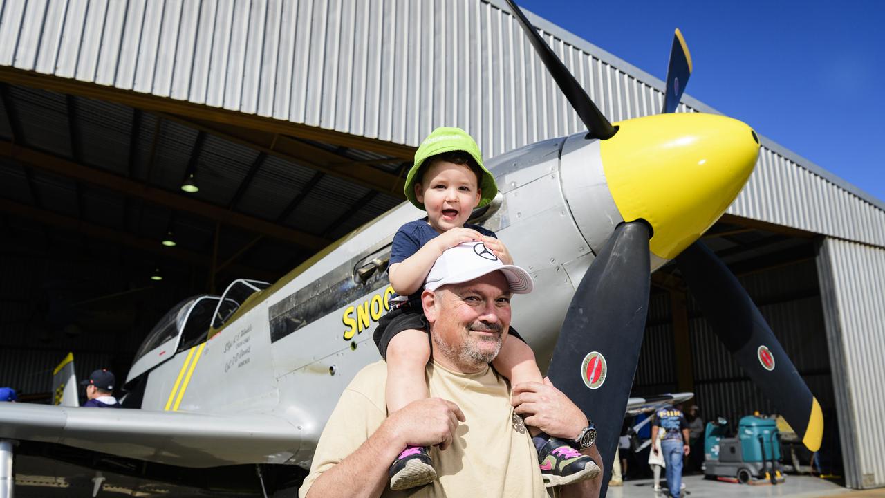 Vance Dean gets a good look at the P-51 Mustang WWII fighter from the shoulders of uncle Craig Scotts at the David Hack Classic, Sunday, May 18, 2025. Picture: Kevin Farmer