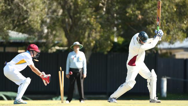 Gold Coast Division 1 Gold Batsman Greg Egan is bowled by Pat Carty as keeper Tony Carter looks on in the Gold Coast Over-60s cricket local derby at Queens Cricket Club Southport. Photograph : Jason O'Brien