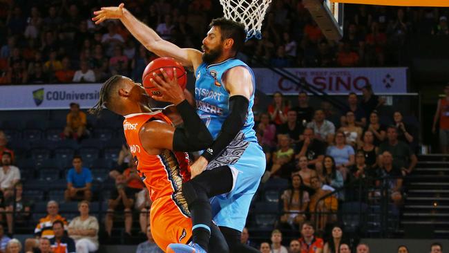 Breakers' Jarrad Weeks fouls Taipans' Scott Machado in the National Basketball League (NBL) match between the Cairns Taipans and the New Zealand Breakers, held at the Cairns Convention Centre. PICTURE: BRENDAN RADKE