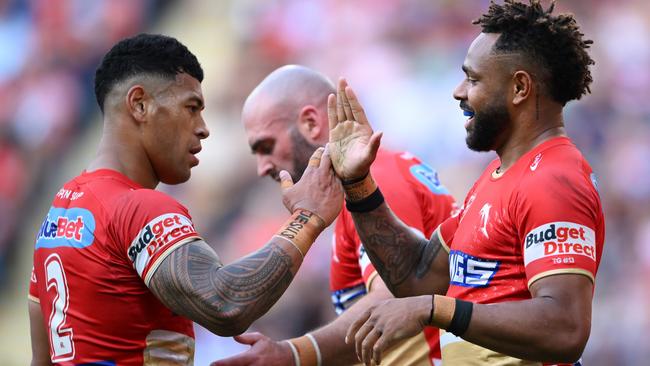 BRISBANE, AUSTRALIA - AUGUST 11: Hamiso Tabuai-Fidow and Jamayne Isaako of the Dolphins celebrate during the round 23 NRL match between Dolphins and New Zealand Warriors at Suncorp Stadium, on August 11, 2024, in Brisbane, Australia. (Photo by Matt Roberts/Getty Images)