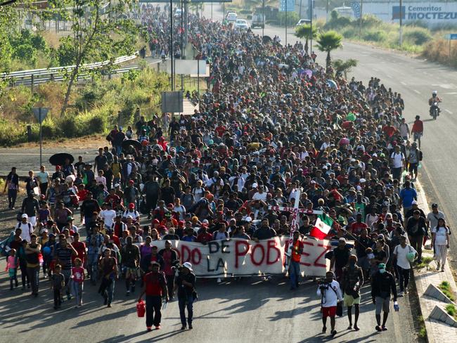 Migrants walk as they leave Tapachula in a caravan to attempt to reach the U.S. border, in the state of Chiapas, Mexico December 24, 2023. REUTERS/Jose Torres