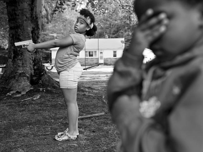 Aliyana, 10, and her brother Bryson, 5, participate in a gun safety class for children at a gun range in rural Maryland, USA. It is a place for African-American gun owners and others to assemble to learn gun safety, self-defence and have a place to target practice. Picture: Matt Mcclain