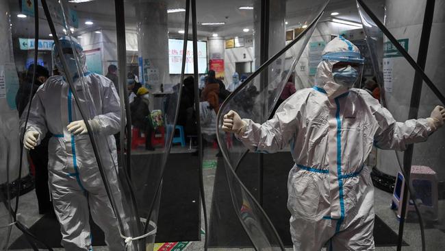 Medical staff wear protective clothing at the Wuhan Red Cross Hospital in Wuhan on January 25. Picture: AFP/Hector Retamal