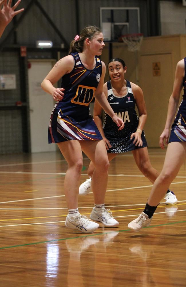 Netball action at QISSN 2024. Canterbury College v Good Shepherd Lutheran College