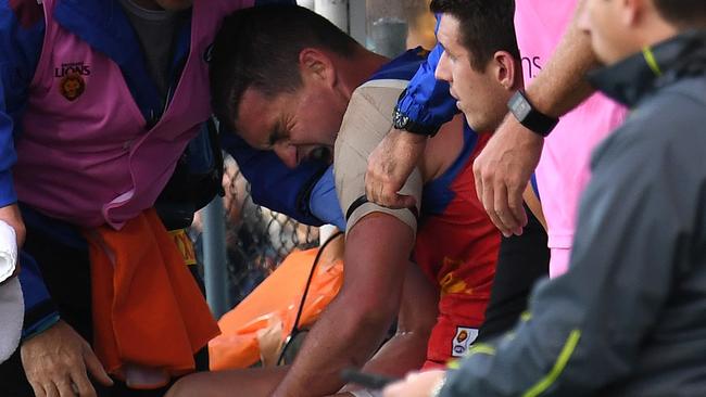 Tom Rockliff in pain on the bench. Picture: AAP Images