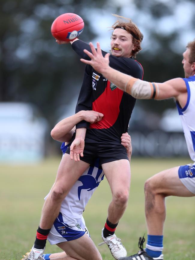 Irrewarra-Beac’s Jacob Frampton has one arm pinned by a South Colac opponent.