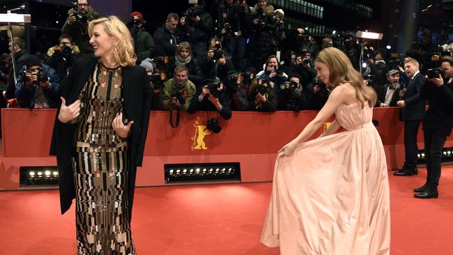 Class act ... Cate Blanchett stopped to help Lily James with her dress on the red carpet. Picture: AFP