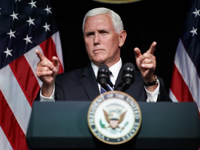 FILE - In this Aug. 9, 2018 file photo, Vice President Mike Pence gestures during an event on the creation of a U. S. Space Force at the Pentagon.  With his demand that the Pentagon create a new military service -- a Space Force to assure â€œAmerican dominance in spaceâ€ -- President Donald Trump has injected urgency into a long-meandering debate over the best way to protect U.S. interests in space, both military and commercial.  (AP Photo/Evan Vucci)