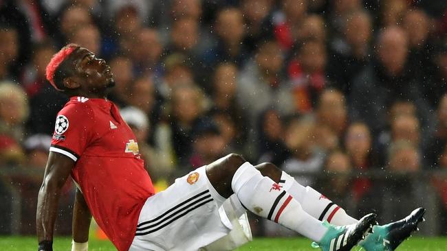 Paul Pogba of Manchester United goes down injured