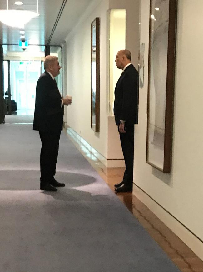 Peter Dutton and Mitch Fifield speak outside the Prime Minister’s office moments before the Liberal party room meeting. Picture: Sharri Markson.