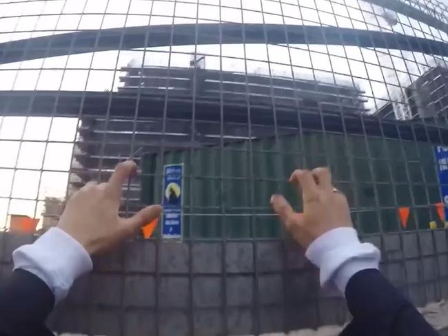 A screenshot of one of the men scaling the fence to the hospital. Picture: Alfie Nevin