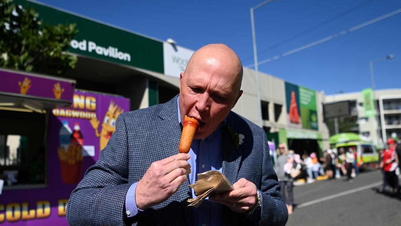 Opposition leader Peter Dutton eating a Dagwood dog making headlines last year Picture: NCA NewsWire / Dan Peled