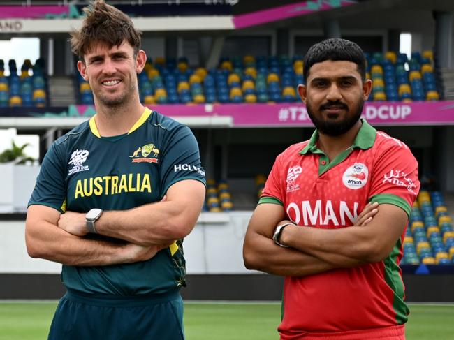 BRIDGETOWN, BARBADOS - JUNE 01: Group B captains Richie Berrington of Scotland, Gerhard Erasmus of Namibia, Jos Buttler of England, Mitchell Marsh of Australia and Aqib Ilyas of Oman pose with the trophy as part of the ICC Men's T20 Cricket World Cup West Indies & USA 2024 at Kensington Oval on June 01, 2024 in Bridgetown, Barbados. (Photo by Gareth Copley/Getty Images)