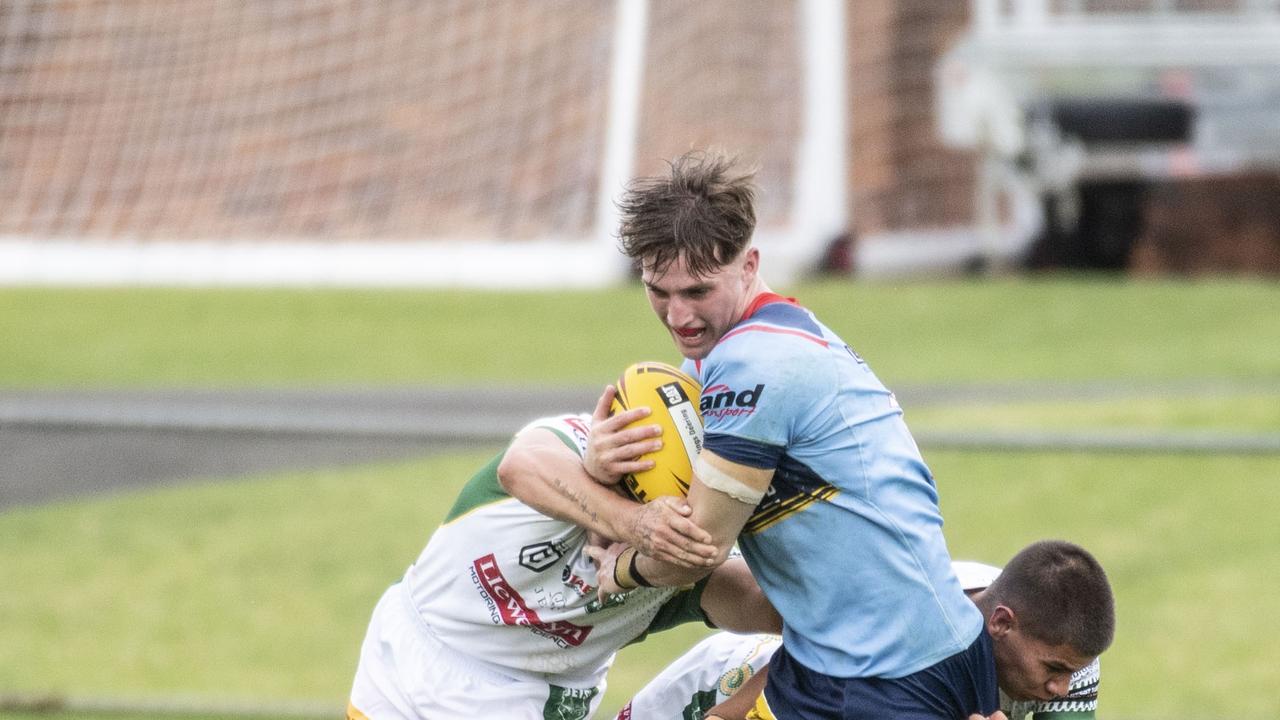 Bud Smith tries to break free of a tackle. Picture: Nev Madsen.