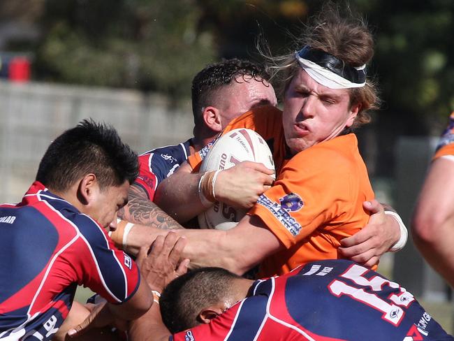 Southport‘s Jack Conlan takes on the Runaway Bay defence. Picture: Mike Batterham