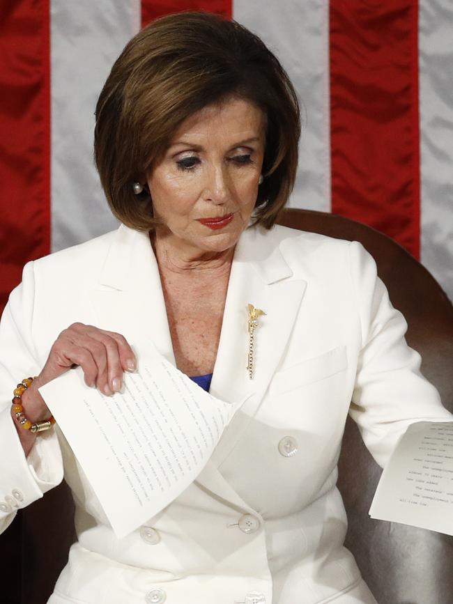 House Speaker Nancy Pelosi tears her copy of President Donald Trump's speech.