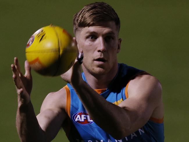 Dylan Moore trains under lights. Picture: Michael Klein