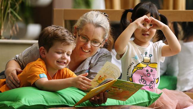 Childcare centre director Liz Christie with Finn and Abbella, both 4, at the Goodstart early learning centre in Brisbane. Picture: Lyndon Mechielsen