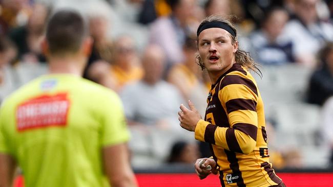 Jack Ginnivan watches the replay. Picture: Dylan Burns/AFL Photos via Getty Images