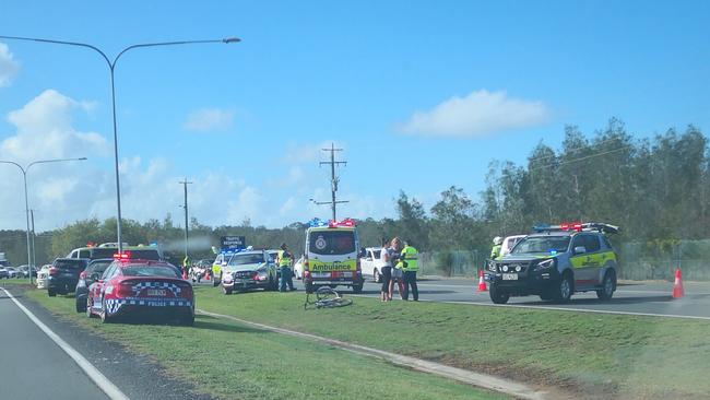 Emergency services at the scene of a pushbike accident on Brisbane Road, Arundel