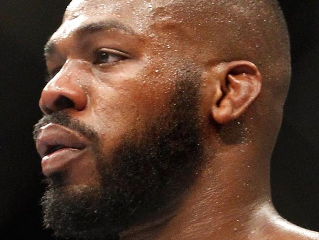 LAS VEGAS, NV - JANUARY 03: Light heavyweight champion Jon Jones waits in a time-out as he defends his title against Daniel Cormier during the UFC 182 event at the MGM Grand Garden Arena on January 3, 2015 in Las Vegas, Nevada. Jones retained his title by unanimous decision. Steve Marcus/Getty Images/AFP == FOR NEWSPAPERS, INTERNET, TELCOS & TELEVISION USE ONLY ==