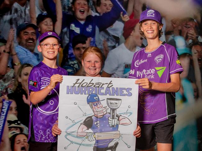 Hurricanes Fans Maverick Appleton, 11, Ellie Appleton, 8, and Flynn Beattie, 13, with the special edition Hurricanes poster at Ninja Stadium.Picture: Linda Higginson