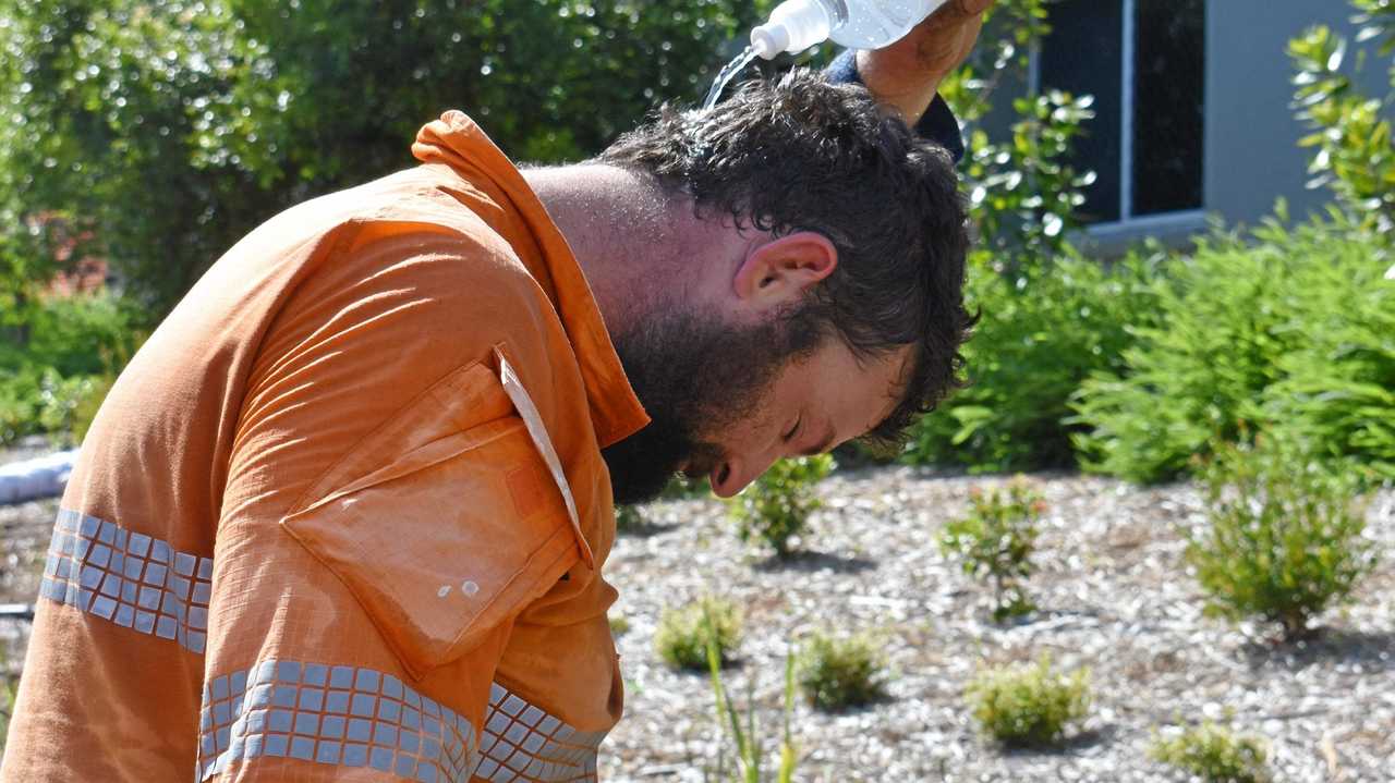 Gympie labourer Dan Stevenson attempts to cool down with a little water. Picture: Donna Jones