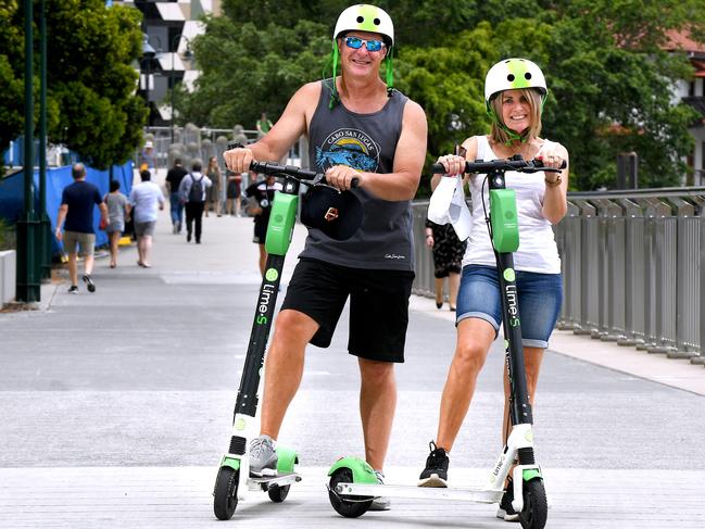 Mark and Liz Ellis from Melbourne riding the Lime scooters for the first time. AAP image/ John Gass