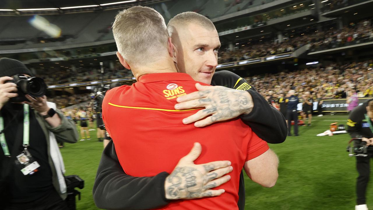 MELBOURNE, AUSTRALIA - AUGUST 24: Dustin Martin of the Tigers and Damien Hardwick, Senior Coach of the Suns embrace after during the round 24 AFL match between Richmond Tigers and Gold Coast Suns at Melbourne Cricket Ground, on August 24, 2024, in Melbourne, Australia. (Photo by Darrian Traynor/Getty Images)