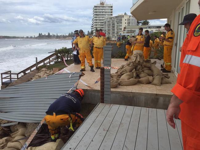 SES crews sand bagging the affected properties along Collaroy Beach after storm hit.