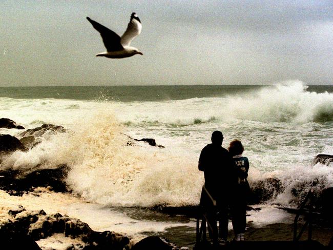 Big savage seas on the Gold Coast beach Anne and Joe Pera of Brisbane.