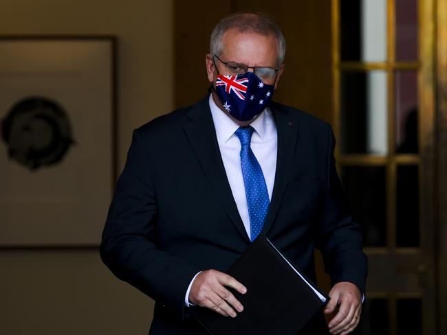 Scott Morrison arrives to speak to the media during a press conference following a national cabinet meeting,