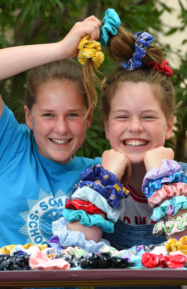 Morgan Hayden and Asha Hayden made 100 hair scrunchies to sell in to raise money for the Red Cross and Wildlife Victoria. Picture: Josie Hayden