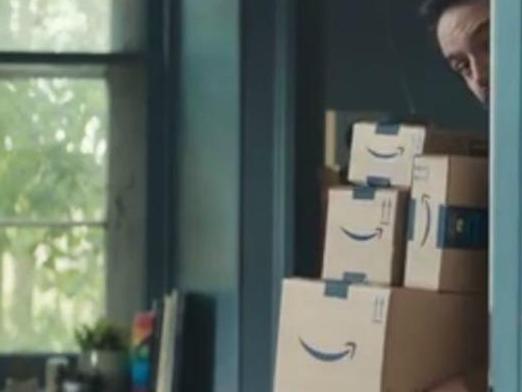 The dad hides behind a wall with the online parcels until his kids ran past. Source: Amazon