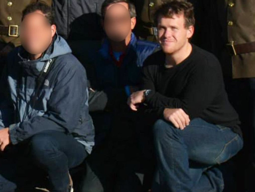 Brenton Harrison Tarrant poses with a tour group visiting the Samjiyon Grand Monument in North Korea. Picture: Supplied