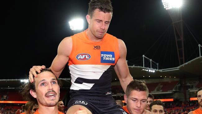 An emotional Brett Deledio gets chaired from the field after what would be his last AFL game. Picture: Phil Hillyard