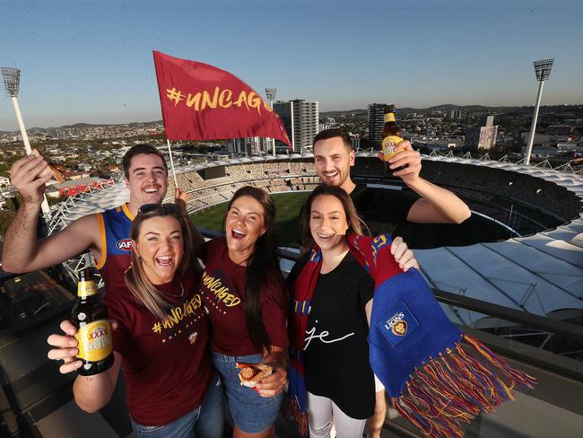 Relishing the view of the Gabba from neighbouring The Duke apartments are (from left) Hugh Keating, Laura Applyard, Sarah Wisley, Teresa Fantasia and Jacob Huggett. Picture: Annette Dew