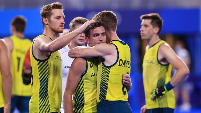 The Kookaburras console each other after their loss to Belgium in the gold medal match. Picture: Adam Head